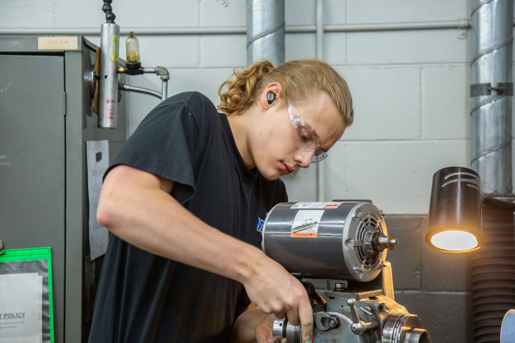 Machine Shop Worker Working On A Component